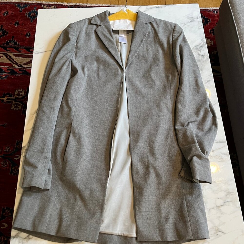 Long Mondi lined grey virgin wool jacket with hook clasp. Size 38/USA size 10